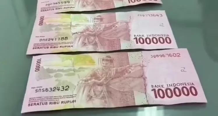 Viral beredar uang mutilasi yang kabarnya setengah asli dan setengah palsu. (Istimewa)