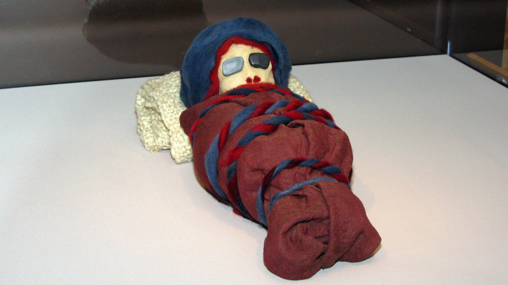 The stand-in mummies, including this infant mummy, were deployed in a last-minute rush by exhibit designer Kate Quinn and her staff.