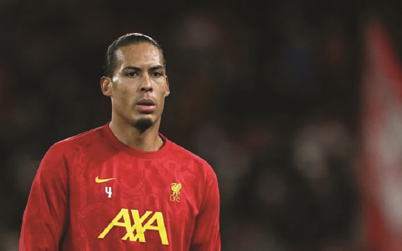 AFP/Oli Scarff LAMPAUI: Bek Liverpool dan timnas Belanda Virgil van Dijk berhasil melampaui Ronaldinho karena berhasil empat kali masuk dalam daftar pemain terbaik dunia versi FIFPro.