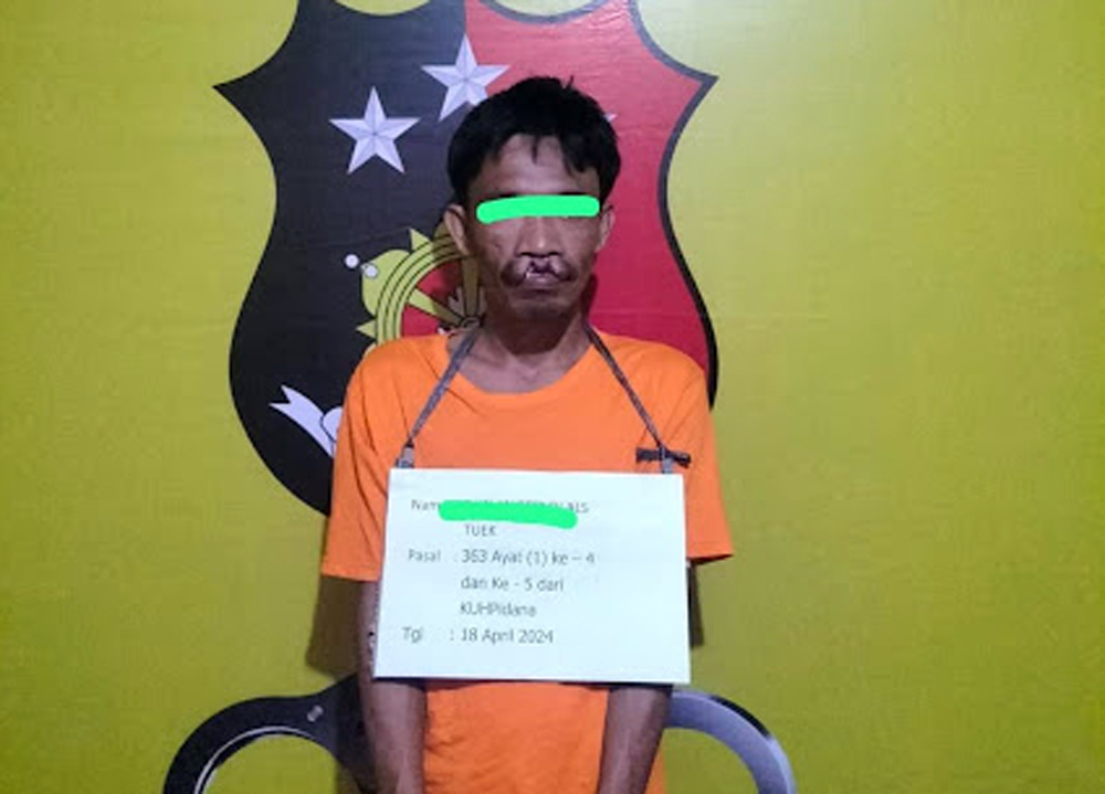Tersangka RE alias Tuek saat diamankan polisi.