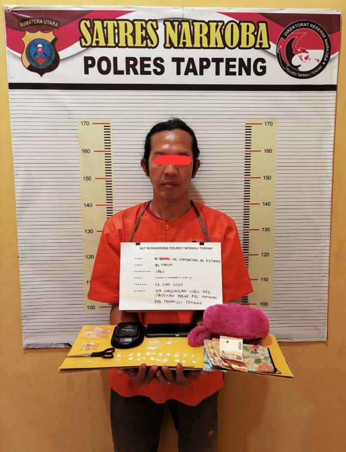 MI alias Gondrong saat diamankan di Mapolres Tapteng.