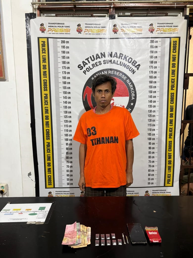 Tersangka Darma Indra Damanik usai ditangkap polisi.