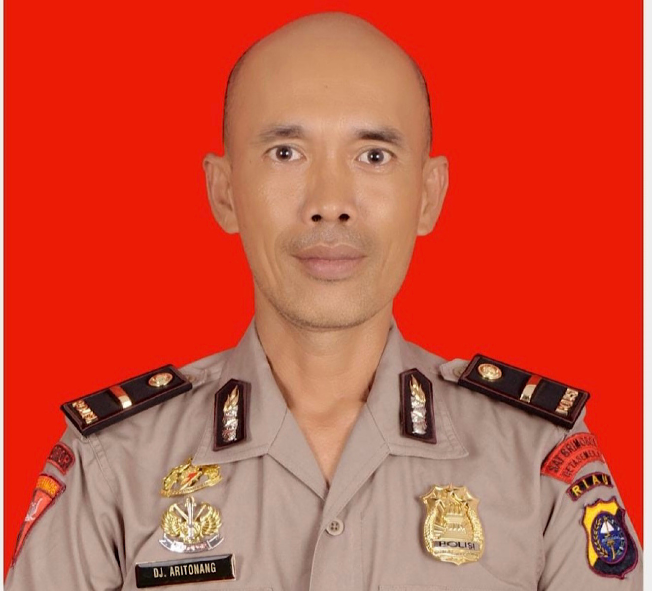 Ipda Donald Junus Halomoan Aritonang, perwira Brimob Polda Riau, meninggal dunia saat menjalankan tugas memadamkan karhutla, Selasa (5/8) pagi.