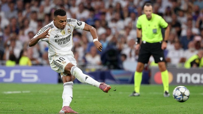 Real Madrid memastikan kemenangan 2-1 atas Marseille meski bermain 10 orang di Santiago Bernabeu.