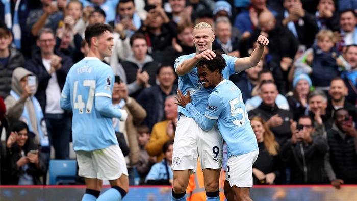 Erling Haaland merayakan golnya saat Manchester City membantai Burnley 5-1 di Etihad Stadium.