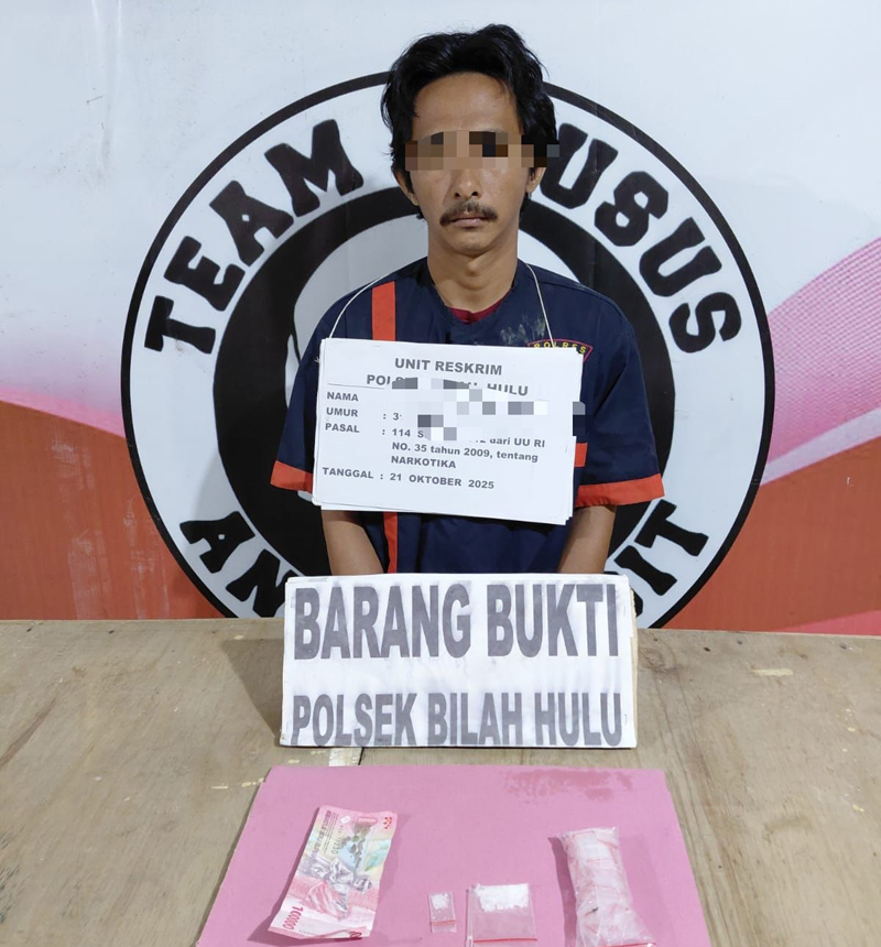 Tersangka MZ saat diamankan polisi.