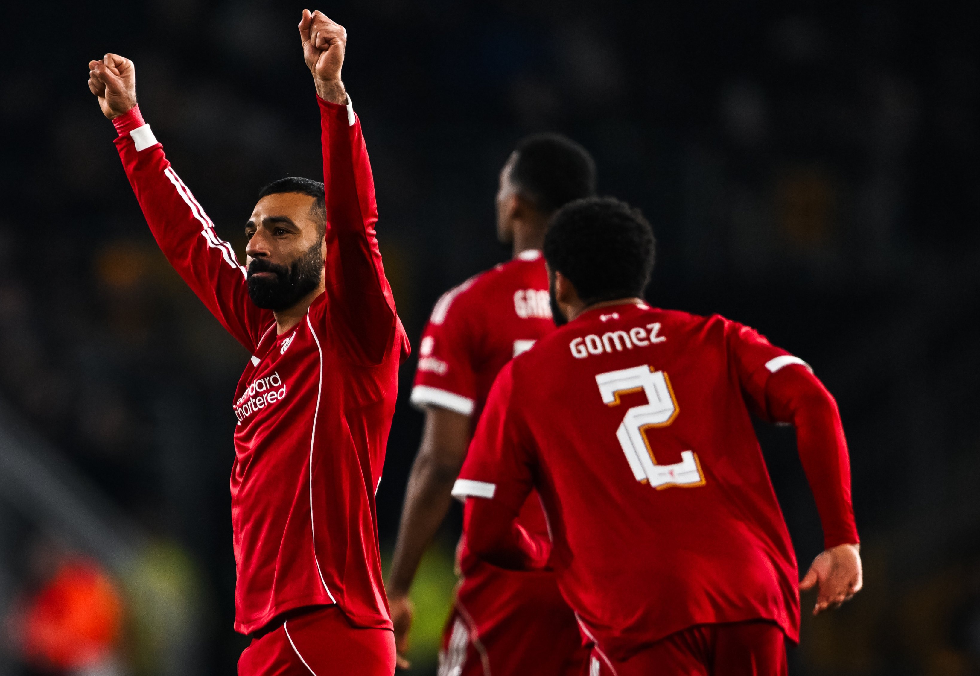 Pemain Liverpool Mohamed Salah merayakan gol ke gawang Wolverhampton Wanderers pada laga putaran kelima Piala FA di Stadion Molineux.