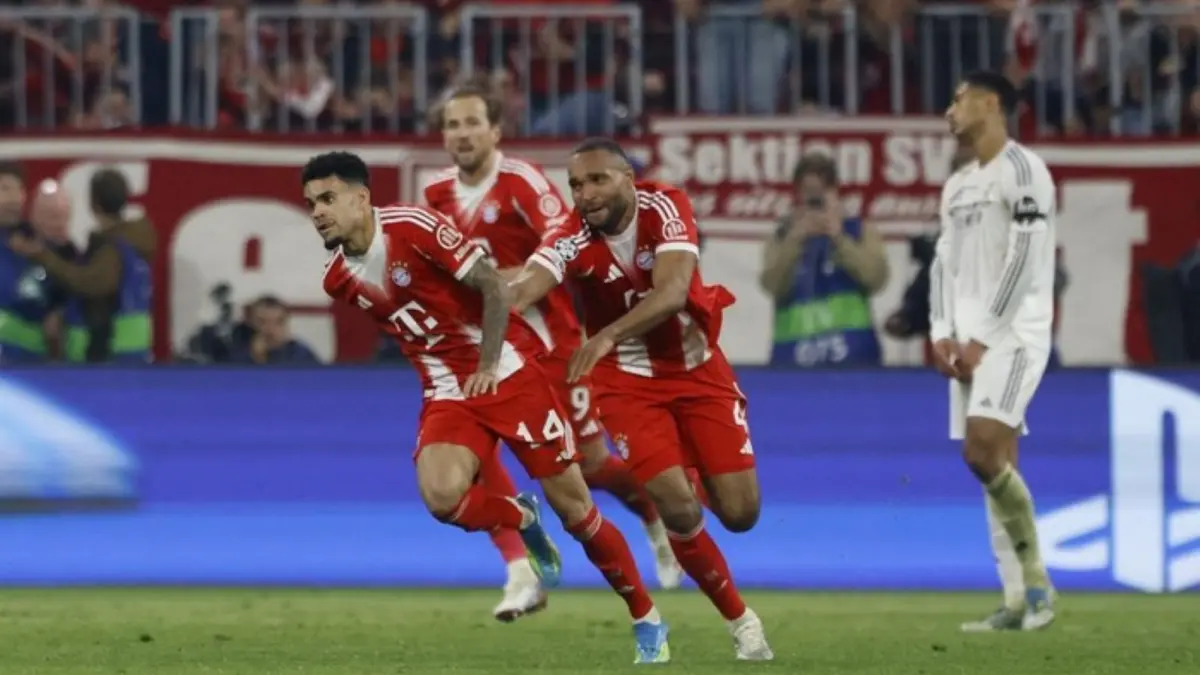 Pemain Bayern Munich merayakan kemenangan dramatis atas Real Madrid yang memastikan langkah ke semifinal Liga Champions.