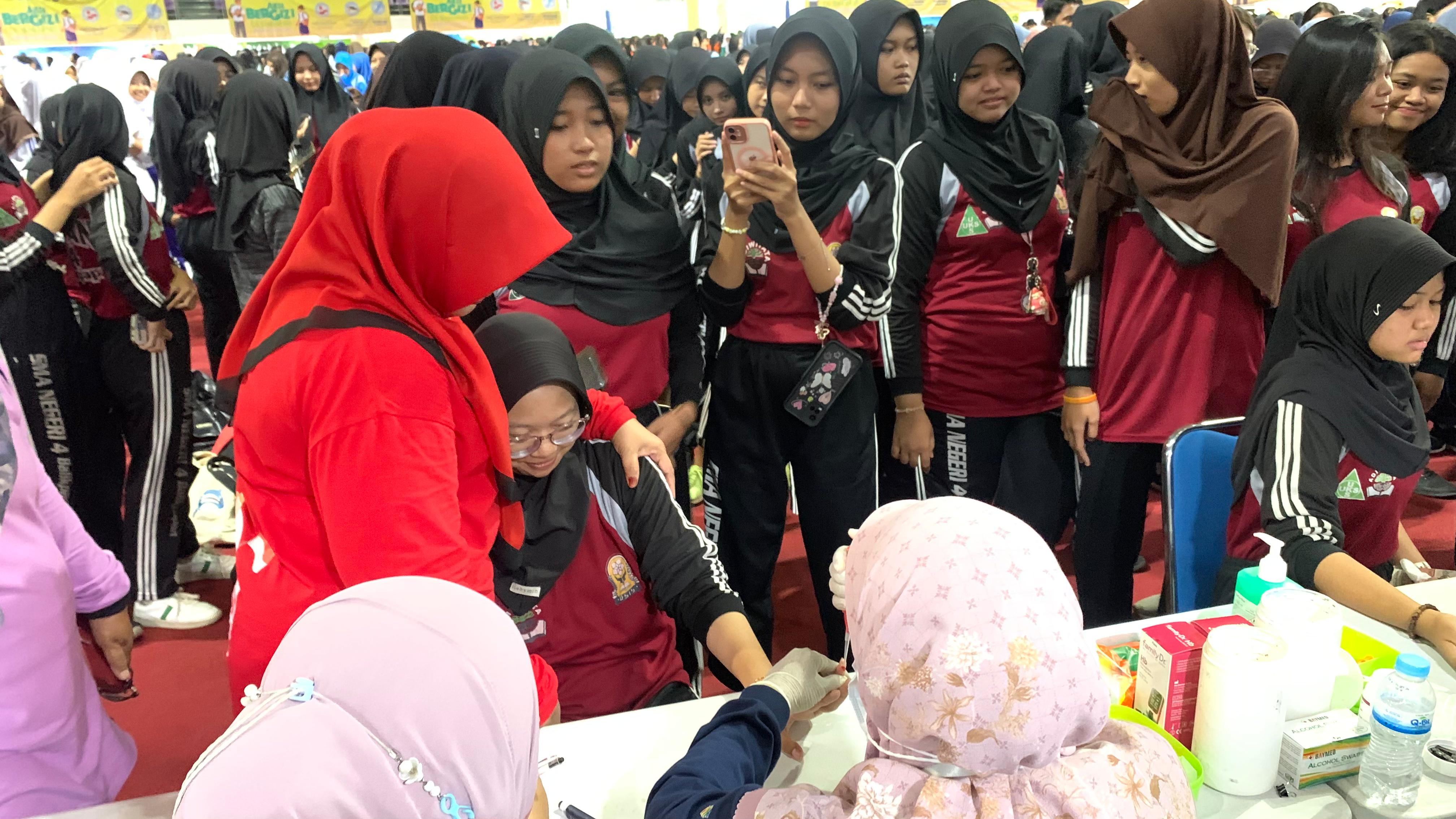 Aksi Bergizi yang diikuti 1.300 siswi di Kota Balikpapan berlangsung di BSCC Dome, Jumat (18/10). (Foto: Anggi/KP)