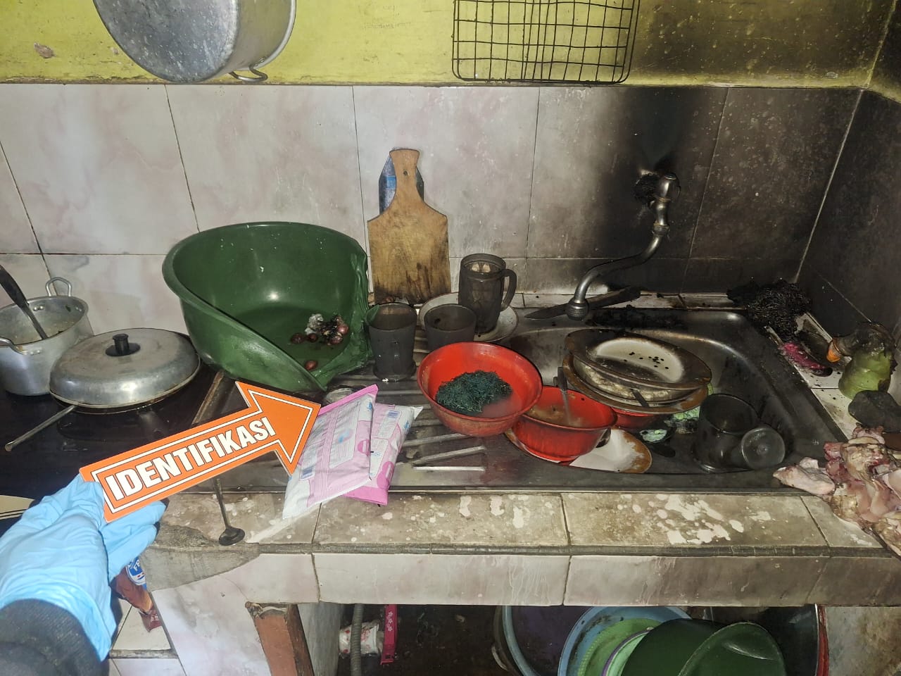 TEGA: TKP peristiwa pembakaran di Jalan Inpres Gang Amuntai, Sangatta Selatan, Kutai Timur, Jumat (7/11/2025).