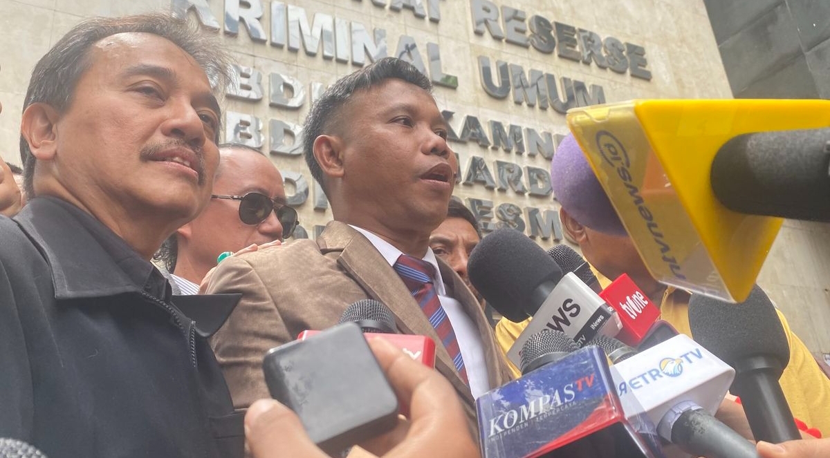 Roy Suryo dan pengacaranya, Ahmad Khozinudin.