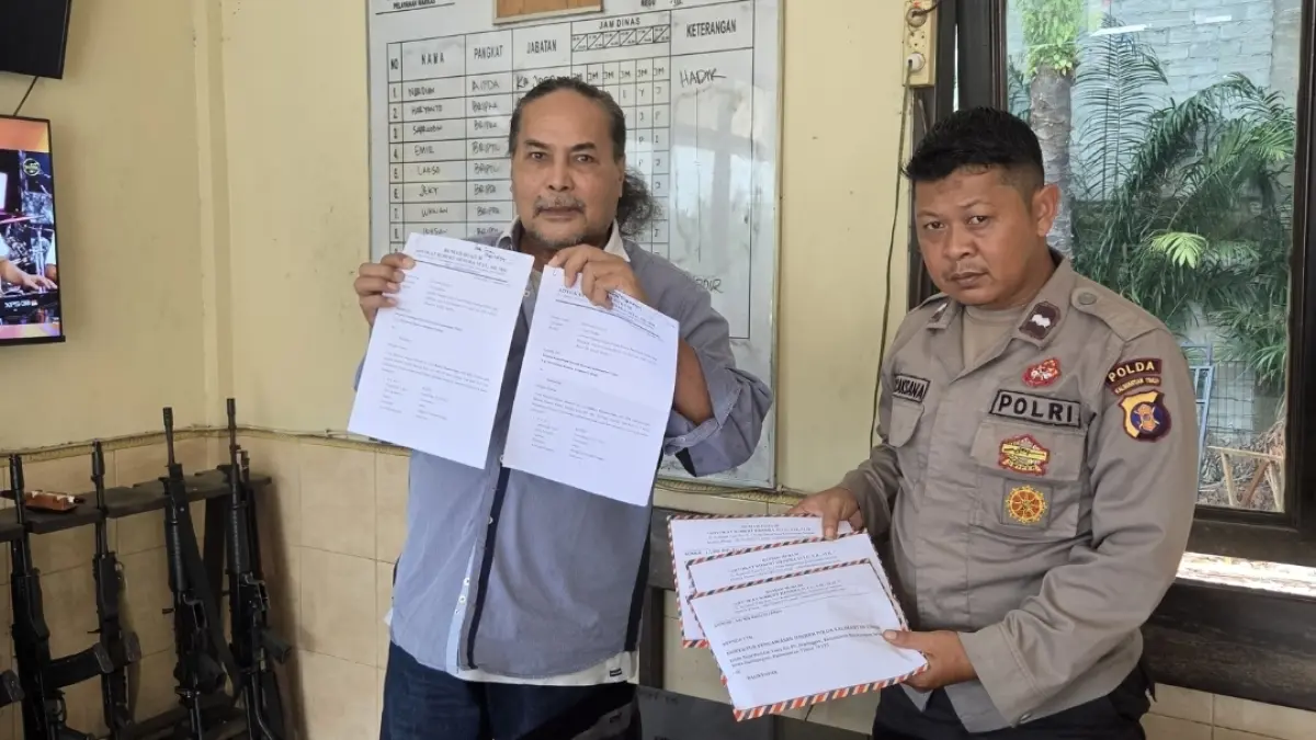 DUGAAN PEMALSUAN : Robert Hendra Sulu (kiri) resmi mendatangi Polda Kaltim untuk melaporkan MY atas aduan tindak pidana pemalsuan pengalihan surat ahli waris.