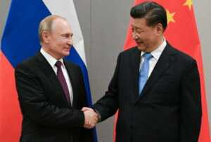 Presiden Rusia Vladimir Putin dan Presiden Tiongkok Xi Jinping.(Sputnik/Ramil Sitdikov/Kremlin via REUTERS)