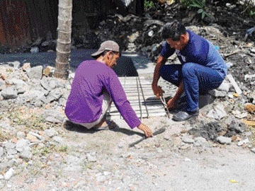 PERBAIKAN: Pengerjaan perbaikan jalan di Kelurahan Kubumarapalam.(IST)