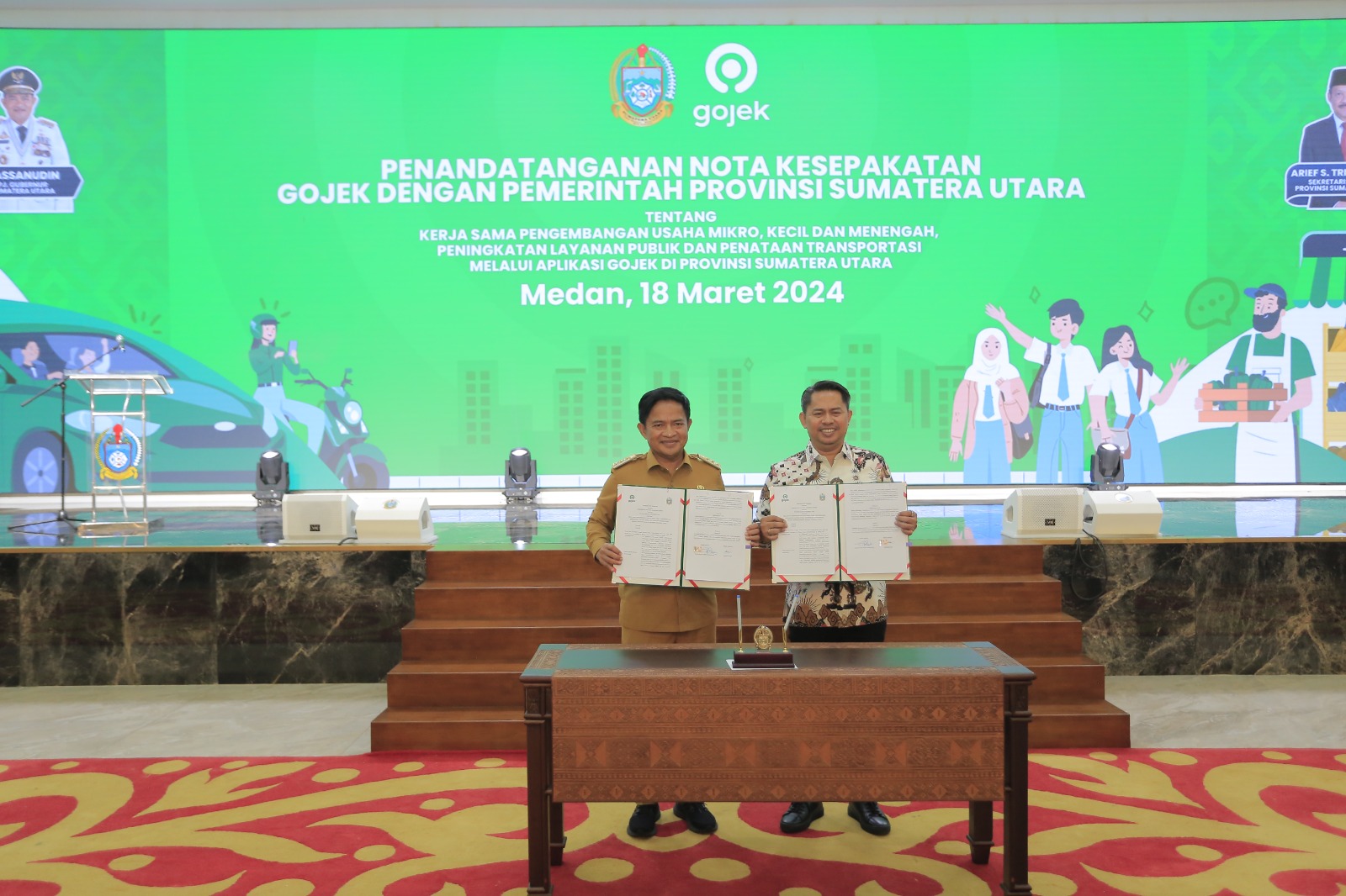 PJ Gubernur Sumut Mayjen TNI (Purn) Hassanudin dan Head of Regions Gojek, Gede Manggala melakukan penandatanganan MoU ini, antara Gojek dan Pemprov Sumut