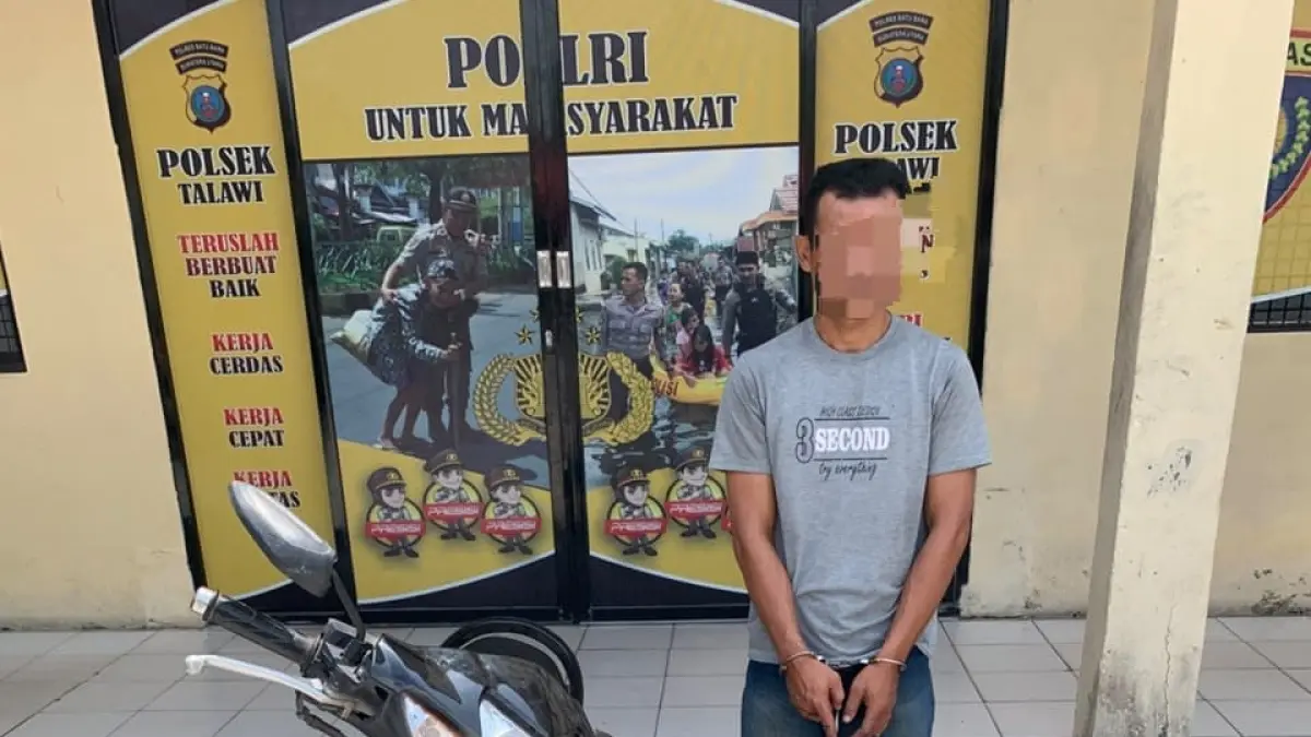 Tersangka berinisial E.K. (42), warga Kota Medan pelaku pencurian kabel tower di Dusun VI Bunga Tanjung, Desa Benteng, Kecamatan Talawi, Kabupaten Batu Bara, Sabtu (25/7/2026) dini hari.( Foto Reskrim Polsek Talawi)