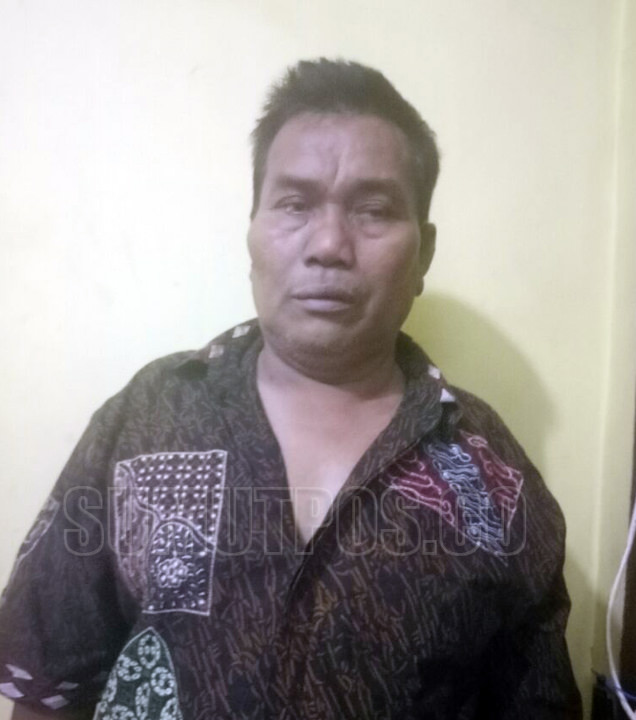 Hotmaruli Tua Hutagalung (60), suami yang membunuh istrinya dengan cara digantung.