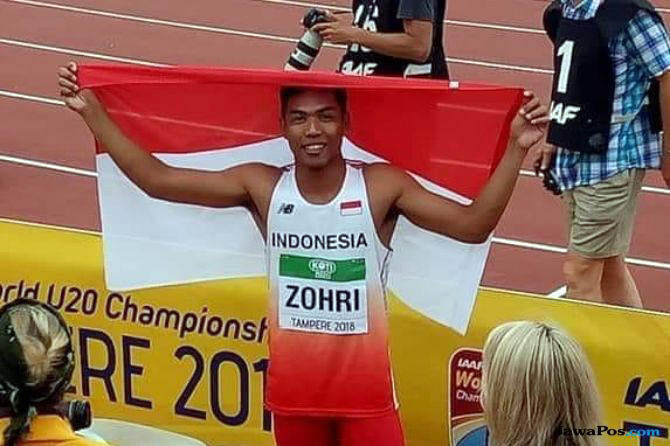 Ekspresi Muhammad Zohri usai menjadi juara nomor 100 meter Kejuaraan Dunia Atletik U-20.
