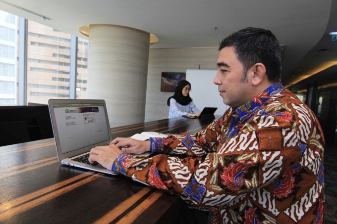 MADINA: Nasabah mengakses layanan Cash Management System PT Bank Muamalat Indonesia Tbk yang bernama Muamalat Digital Integrated Access (Madina) di Jakarta, Rabu (5/7/2023).