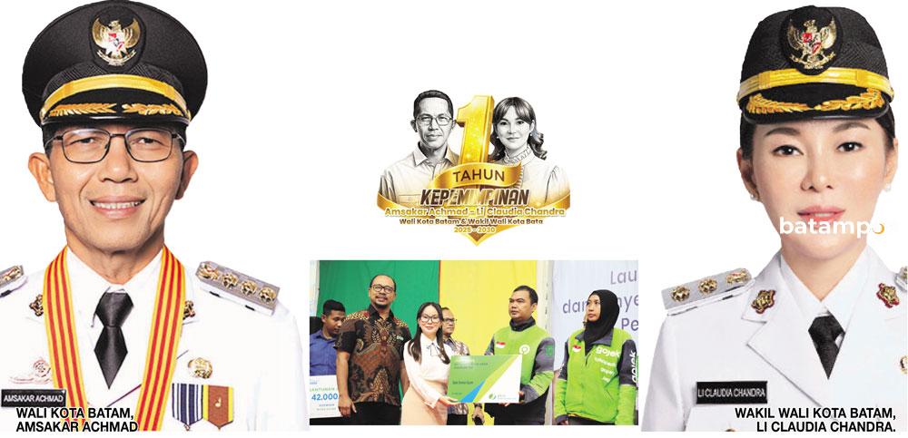 (Foto Tengah) Wakil Wali Kota Batam, Li Claudia Chandra, menyerahkan secara simbolis bantuan kartu BPJS Ketenagakerjaan kepada pengemudi ojek online, belum lama ini.