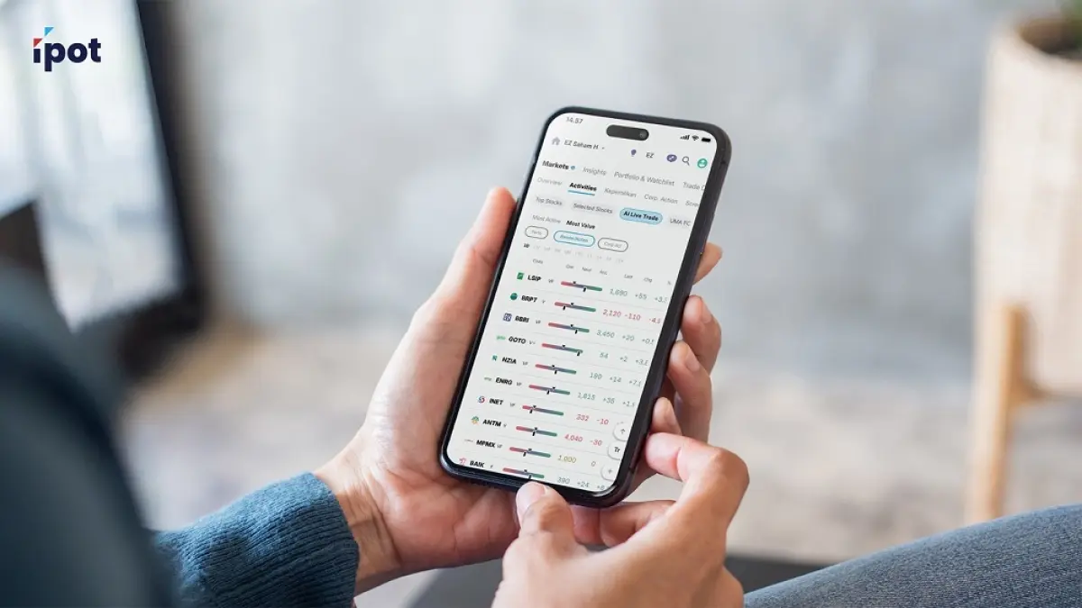 Aplikasi IPOT dengan fitur AI real-time yang menampilkan data pergerakan saham secara langsung. F. Jawa Pos