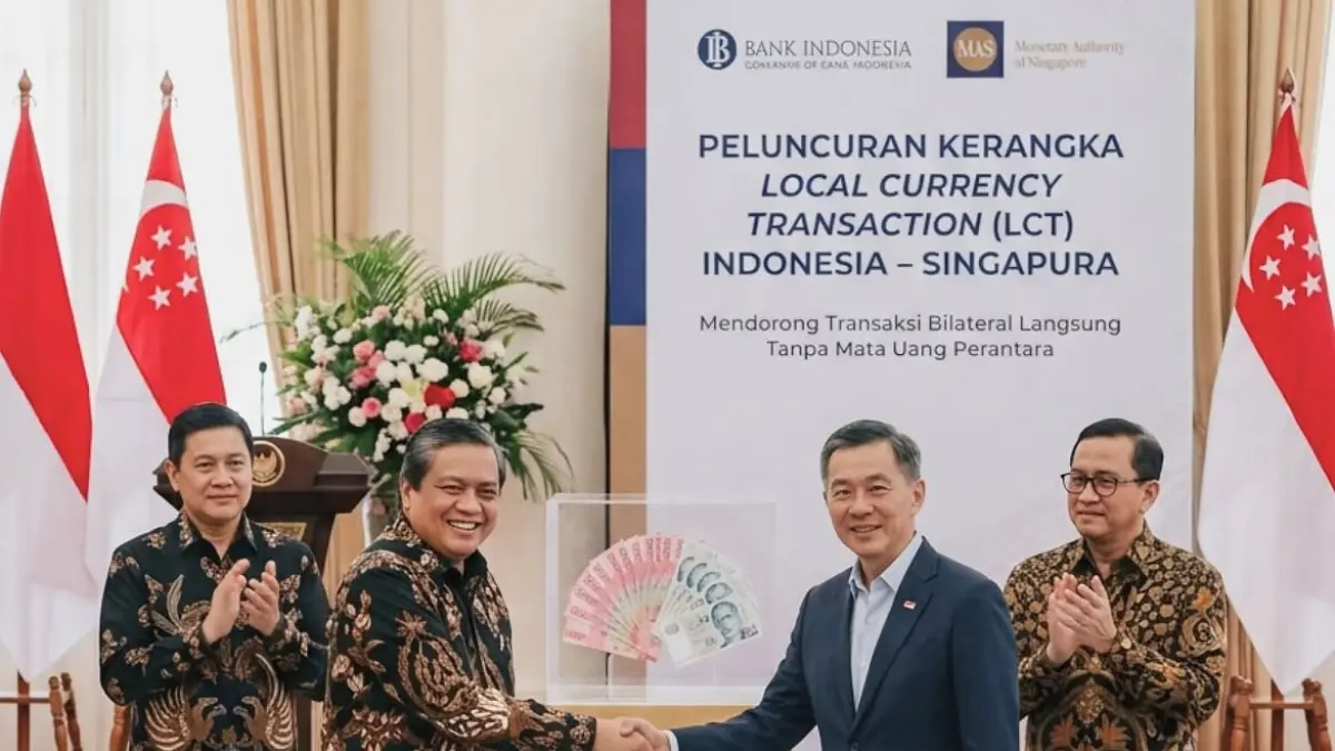 BI dan MAS resmi menerapkan transaksi mata uang lokal  F. IG BI