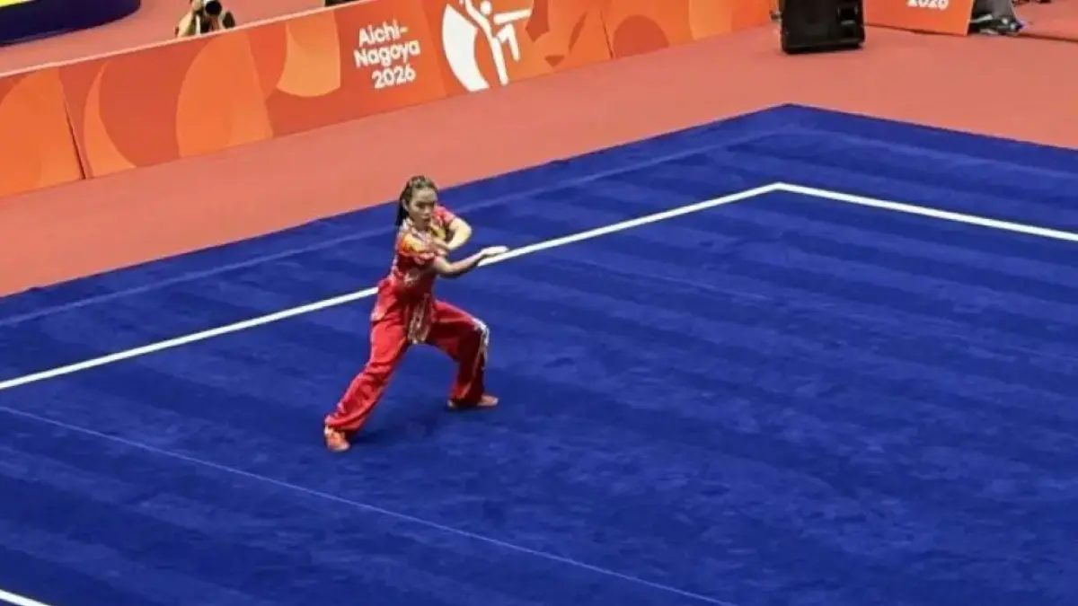 Atlet wushu putri Indonesia Eugenia Diva Widodo beraksi dalam nomor changquan putri Asian Games 2026. (Arindra Meodia/Antara)
