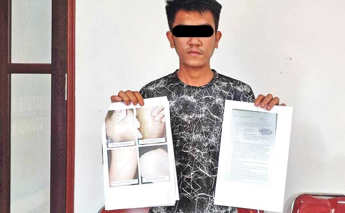 MENCARI KEADILAN: Juandi, warga Desa Pujon, Kuala Kapuas, melapor ke Propam Polda Kalteng terkait dugaan salah tangkap yang dialaminya. DODI/RADAR SAMPIT