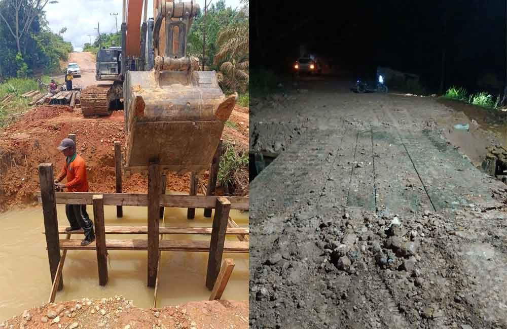 Pembuatan jembatan darurat di jalan kabupaten tiga desa di Telaga Antang yang sempat putus akibat digerus hujan deras. (BPBD Kotim)