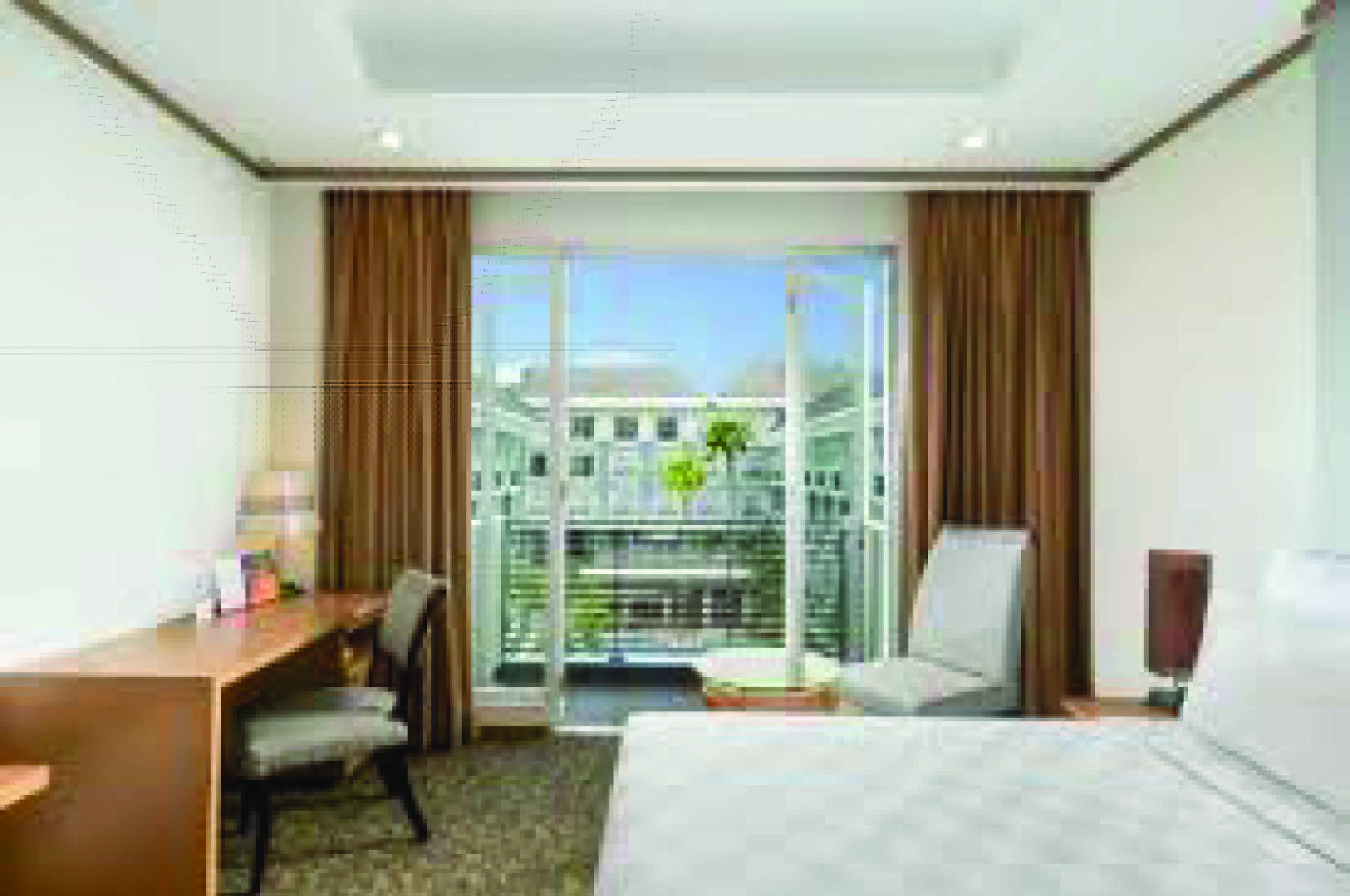 Kamar Deluxe di Swiss-Belhotel Danum Palangka Raya yang menawarkan kenyamanan dengan fasilitas modern serta pemandangan luar dari jendela kamar.  