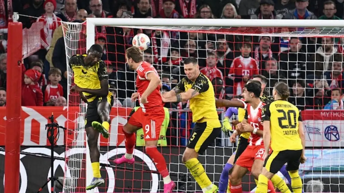 Gol sundulan Harry Kane, lepas dari penjagaan Serhou Guirassy dan Niklas Sule. (Dok REUTERS)