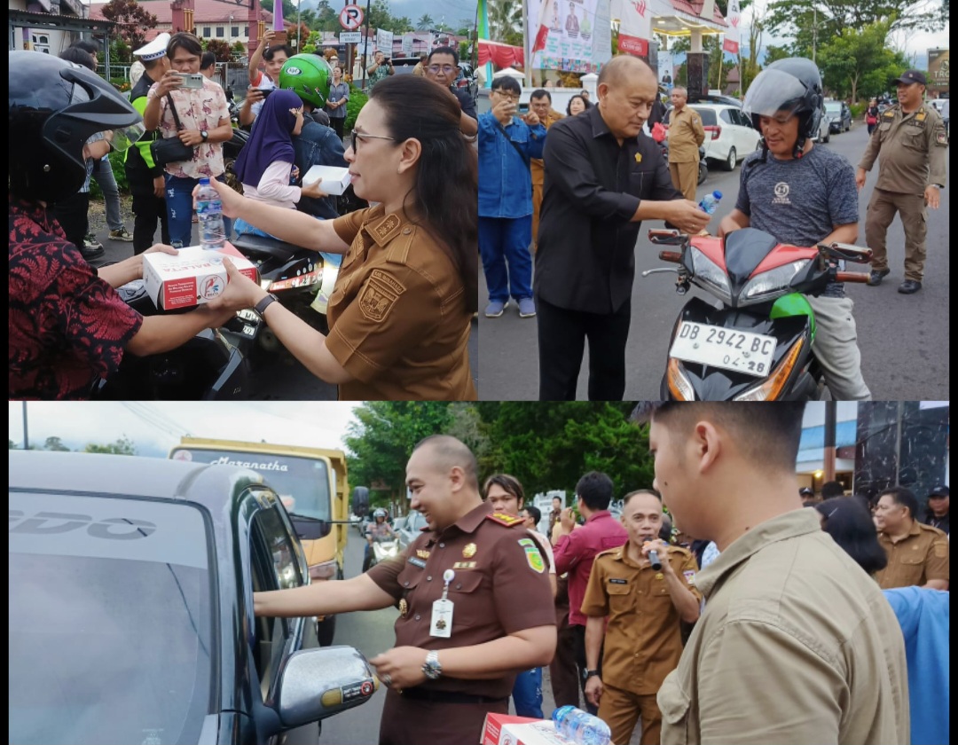 BAGI TAKJIL: Wabup Vanda Sarundajang, Ketua DPRD Robby Longkutoy, dan Kajari B Hermanto saat membagikan takjil kepada pengendara, Selasa (25/3/2025).