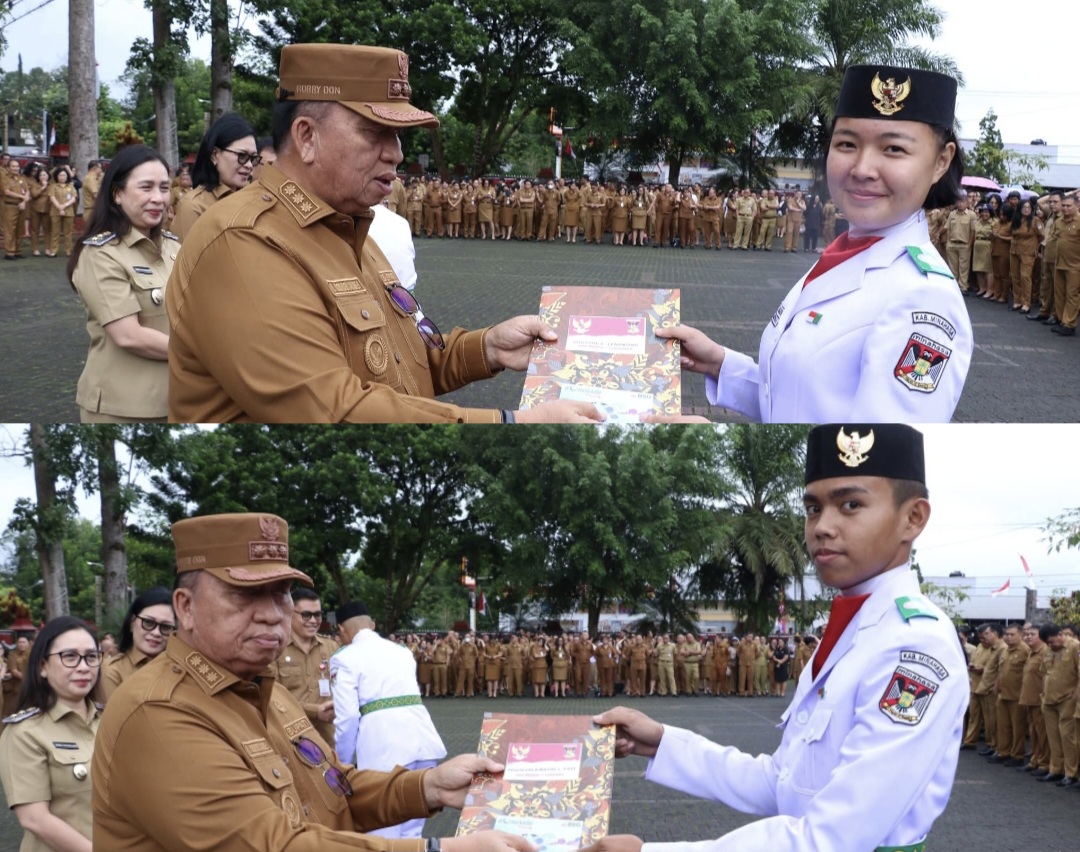 SERAHKAN: Bupati Robby Dondokambey menyerahkan piagam kepada anggota Paskibraka di Minahasa, Senin (1/9/2025).