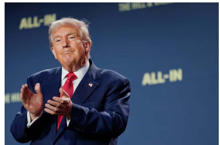 U.S. President Donald Trump applauds at the "Winning the AI Race" Summit in Washington D.C., U.S.