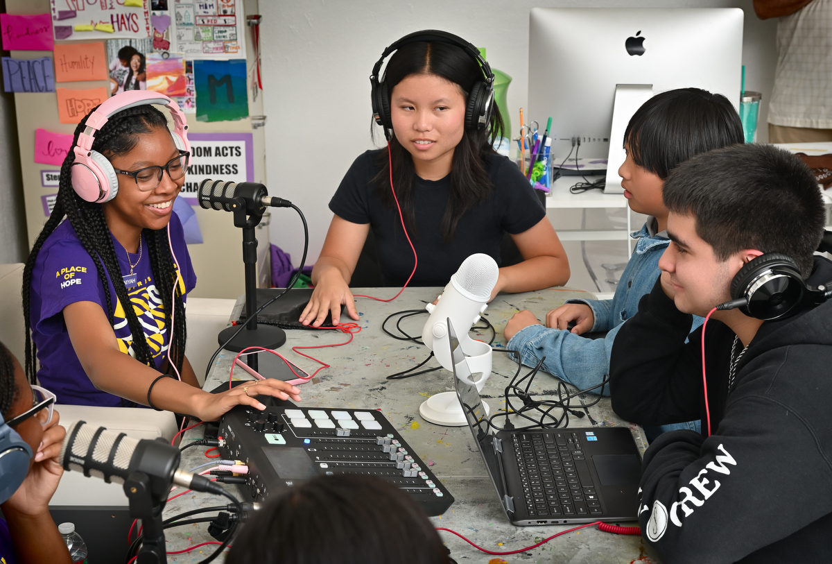 Aniyan Mingo, 16, left, Sandra Nguyen, 15, Brandon Tan, 12, and Donald Blackwell, 16, give their input during a group podcast talking about how COVID interrupted their social lives and affected the lives of those who where hit hard by the virus. Photo by