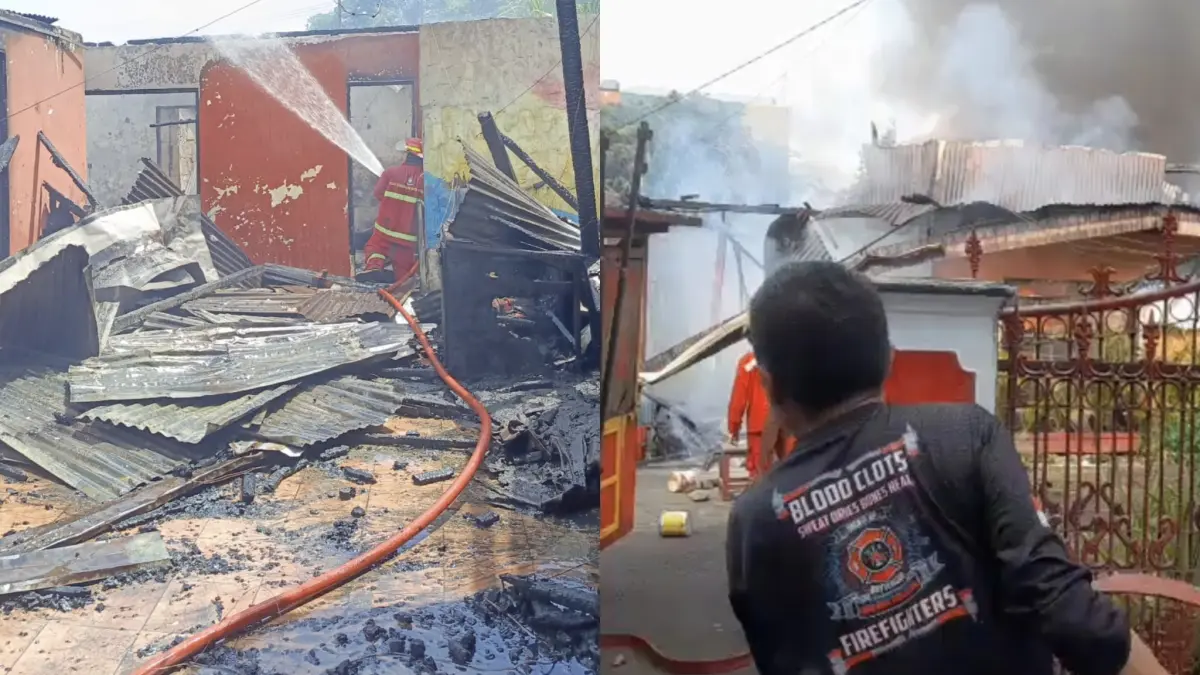 TANGGAP: Petugas pemadam saat melakukan penanganan musibah kebakaran yang terjadi di dua lokasi di Kota Manado, Minggu (24/5)