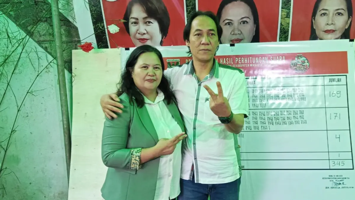 Hukum Tua Desa Maumbi terpilih Silvana Keintjem didampingi suami Wemly Lukas.(Franky/MP)