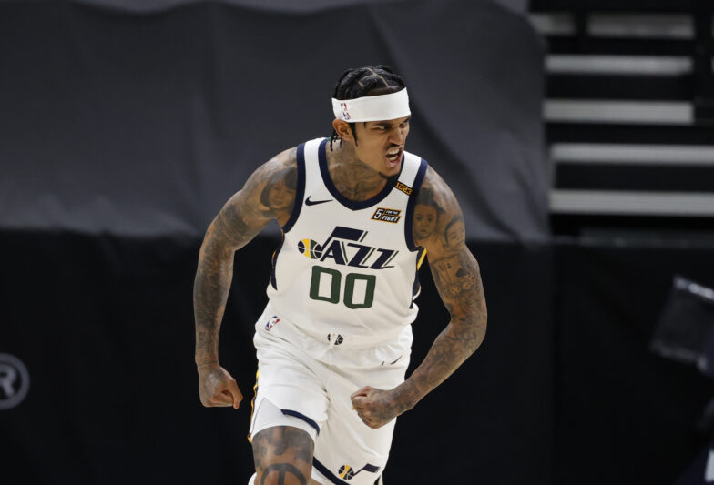 SALT LAKE CITY, UT - MARCH 26: Jordan Clarkson #00 of the Utah Jazz celebrates during the game against the Memphis Grizzlies on March 26, 2021 at vivint.SmartHome Arena in Salt Lake City, Utah. NOTE TO USER: User expressly acknowledges and agrees that, by