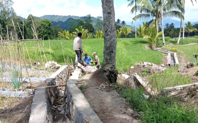 Pekerjaan program P3-TGAI di desa Moonow, Kecamatan Modayag Barat, Kabupaten Bolaang Mongondow Timur.
