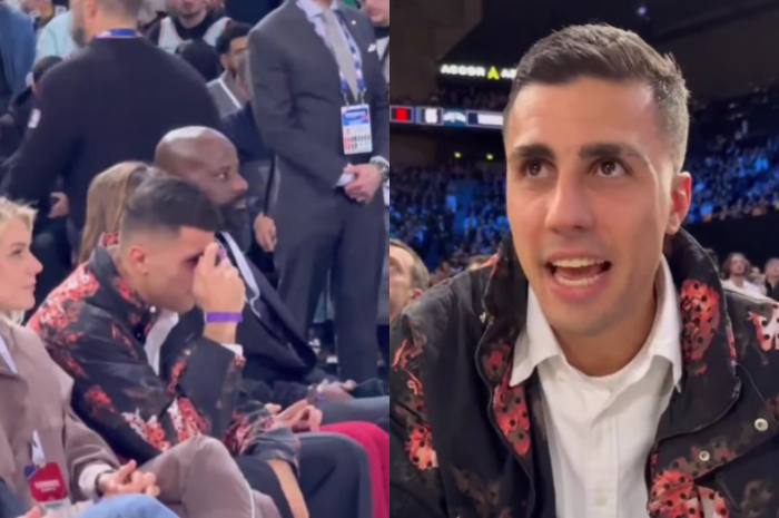 Gelandang Manchester City, Rodri saat menonton laga NBA.