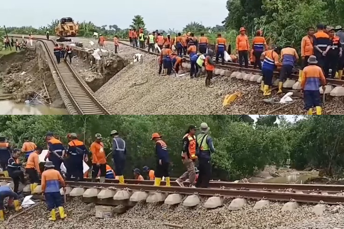 Petugas saat melakukan perbaikan jalur yang rusak.