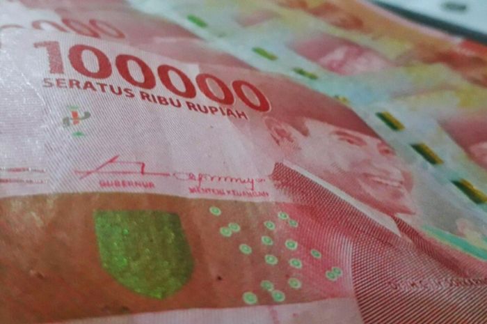 Ilustrasi uang pencairan bantuan sosial.