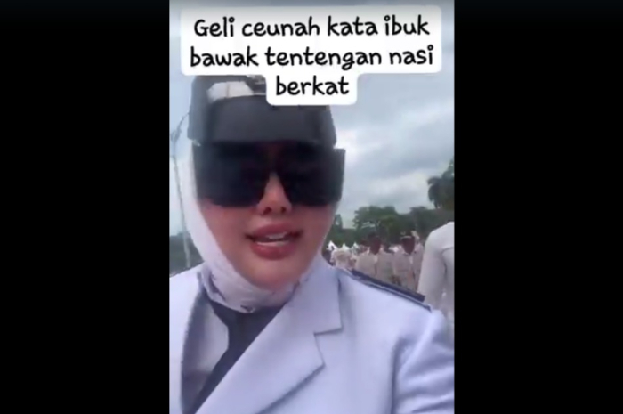 Tangkapan layar video Kades Gunung Menyan Bogor Wiwin Komalasari yang mengaku geli dapat bingkisan nasi box.
