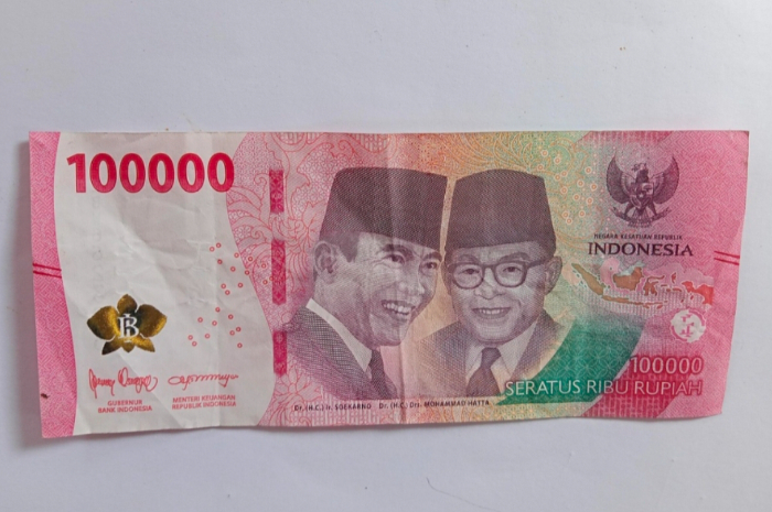 Ilustrasi uang pencairan bansos.