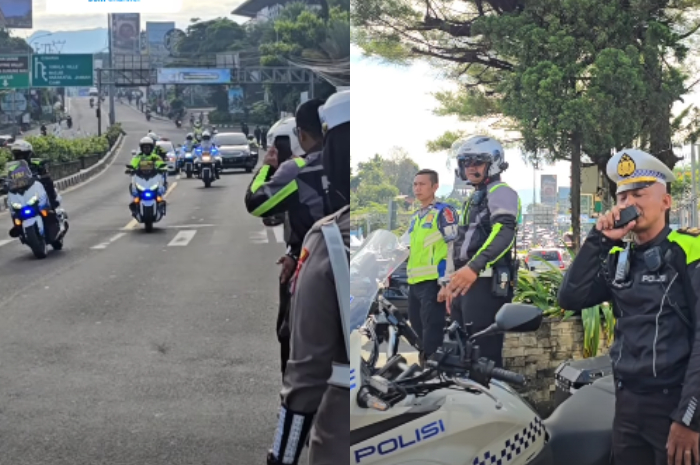 Polisi saat memberlakukan one way atau sistem satu arah di kawasan Puncak, Kabupaten Bogor.