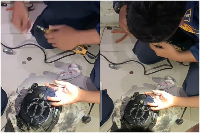 Petugas Damkar saat melakukan evakuasi jari korban yang masuk ke blok mesin motor.