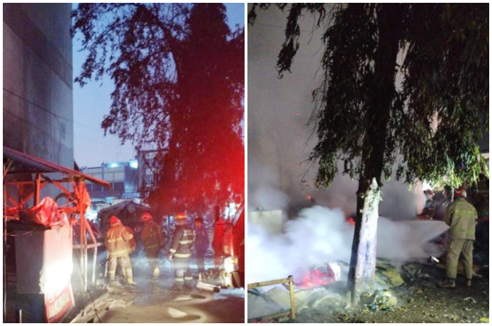 Petugas Damkar saat melakukan pemadaman api yang membakar 4 lapak pedagang di Pasar Cibinong.