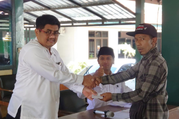 Caption: Penyaluran Bansos di Desa Poncosari