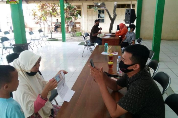 Ilustrasi penyaluran bansos PKH BPNT.