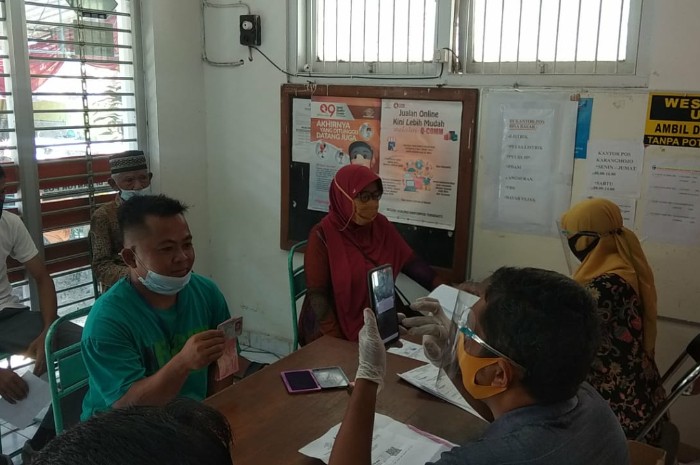 Ilustrasi penyaluran bansos PKH BPNT dan PIP.